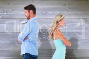 Composite image of unhappy couple not speaking to each other