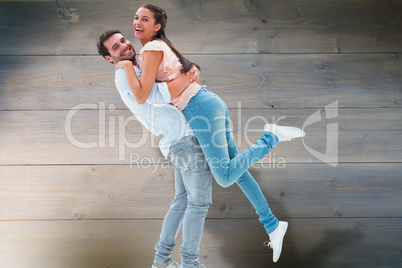 Composite image of attractive young couple hugging each other