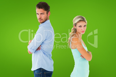 Composite image of unhappy couple not speaking to each other Composite image of unhappy couple not speaking to each other