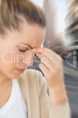 Composite image of woman with headache