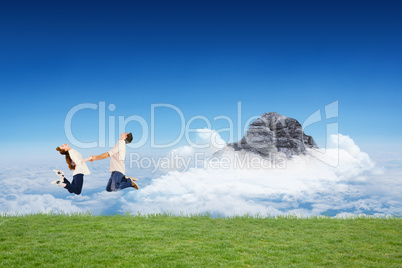 Composite image of couple jumping and holding hands