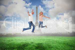 Composite image of excited couple cheering and jumping