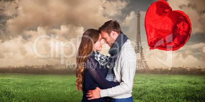 Composite image of side view of young couple embracing