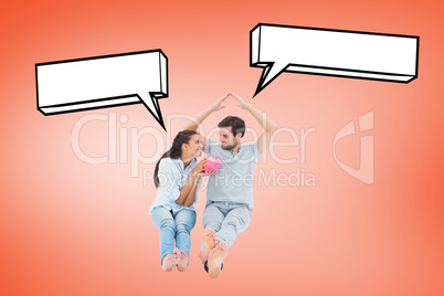 Composite image of cute couple considering a mortgage