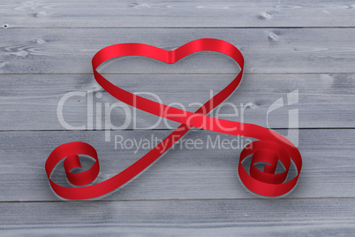 Large red ribbon in a heart shape