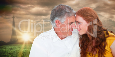 Composite image of casual couple smiling at each other