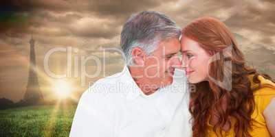 Composite image of casual couple smiling at each other