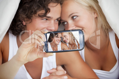 Couple taking selfie on smartphone