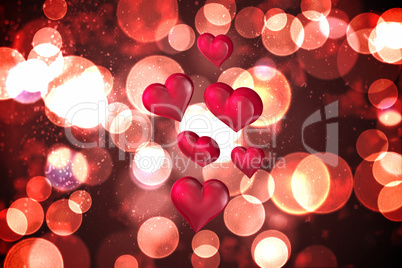 Composite image of floating love hearts