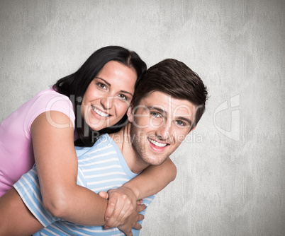 Composite image of young couple smiling at the camera