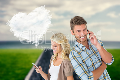 Composite image of attractive couple using their smartphones