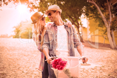 Hip young couple going for a bike ride