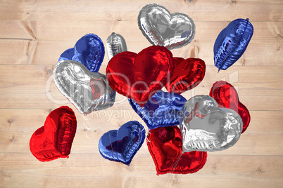 Composite image of heart balloons