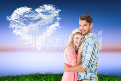 Composite image of attractive couple embracing and smiling at ca