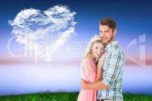 Composite image of attractive couple embracing and smiling at ca