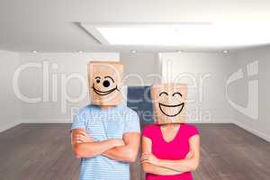 Composite image of young couple with bags over heads