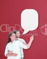 Composite image of cute couple embracing and pointing