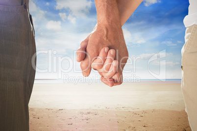 Composite image of happy senior couple holding hands