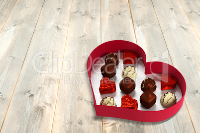 Open red heart shaped candy box
