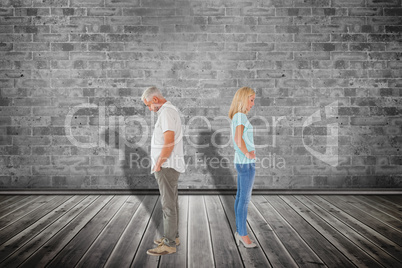 Composite image of unhappy couple not speaking to each other