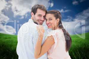 Composite image of attractive young couple smiling at camera