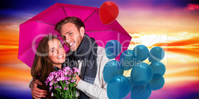 Composite image of cheerful young couple with flowers and umbrel