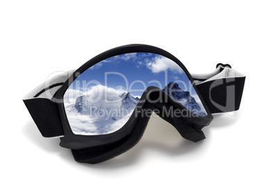 Ski goggles with reflection of winter mountains