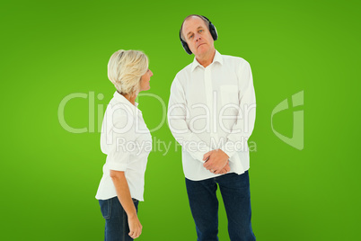 Composite image of annoyed woman being ignored by her partner