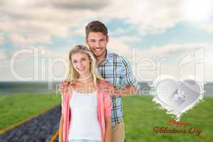 Composite image of attractive young couple smiling at camera