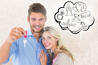 Composite image of attractive young couple showing new house key