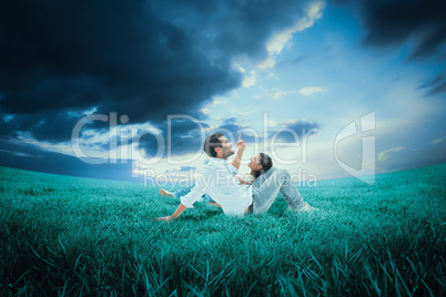 Composite image of attractive young couple lying down