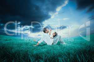 Composite image of attractive young couple lying down