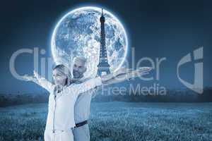 Composite image of happy couple standing with arms outstretched