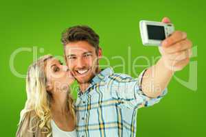 Composite image of attractive couple taking a selfie together