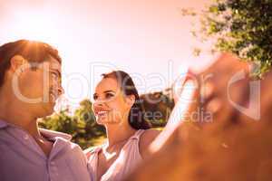 Loving and happy couple dancing at park