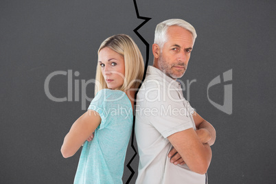 Composite image of unhappy couple not speaking to each other