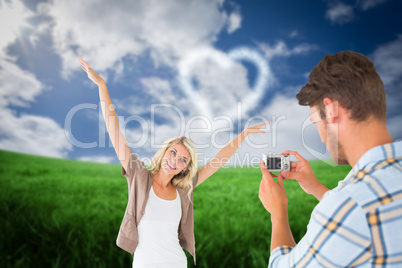 Composite image of man taking photo of his pretty girlfriend