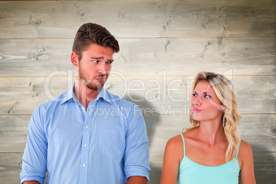 Composite image of young couple making silly faces