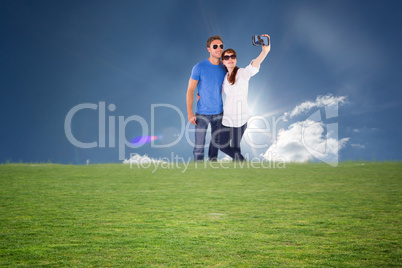 Composite image of couple using camera for picture Composite image of couple using camera for picture