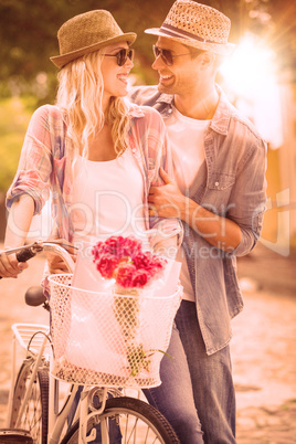 Hip young couple going for a bike ride