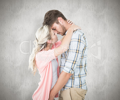 Composite image of attractive young couple about to kiss