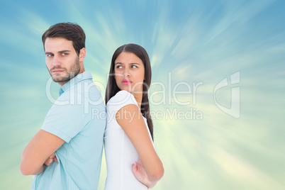 Composite image of unhappy couple not speaking to each other