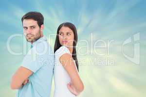 Composite image of unhappy couple not speaking to each other