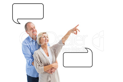 Composite image of happy mature couple embracing and looking Composite image of happy mature couple embracing and looking