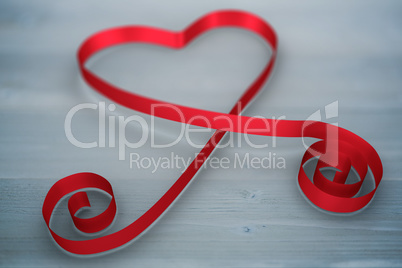 Composite image of red ribbon heart