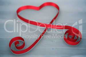 Composite image of red ribbon heart
