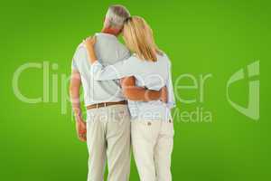 Composite image of happy couple standing and looking