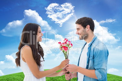 Composite image of happy hipster giving his girlfriend roses