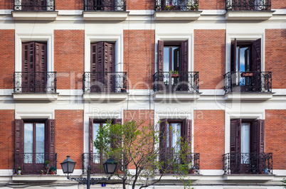 Typical building facade on a spring day in Madrid, Spain