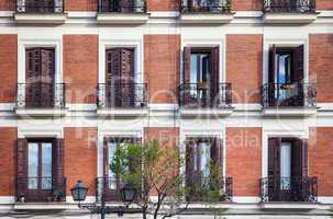 Typical building facade on a spring day in Madrid, Spain